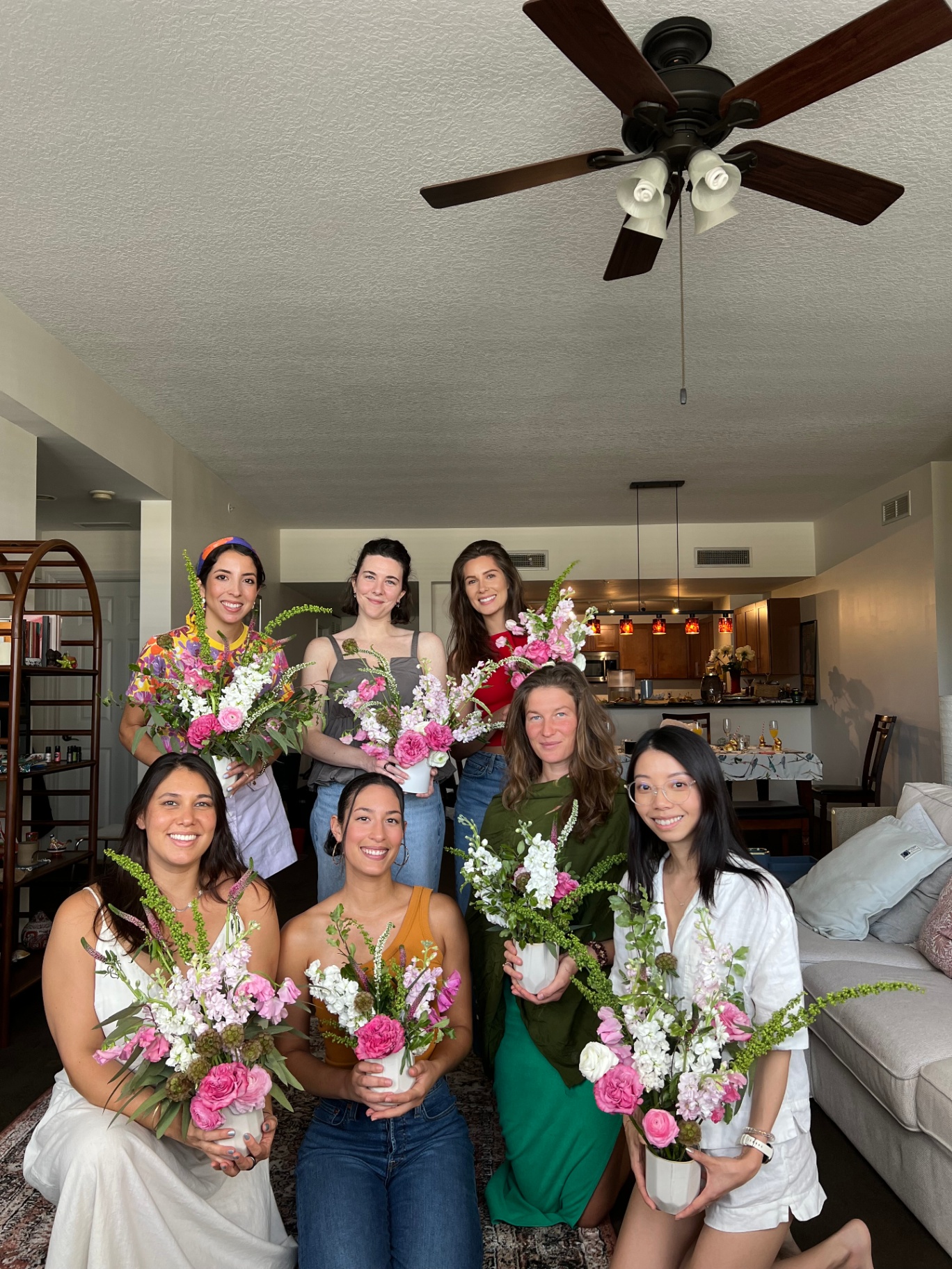 Group photo with flower bouquets