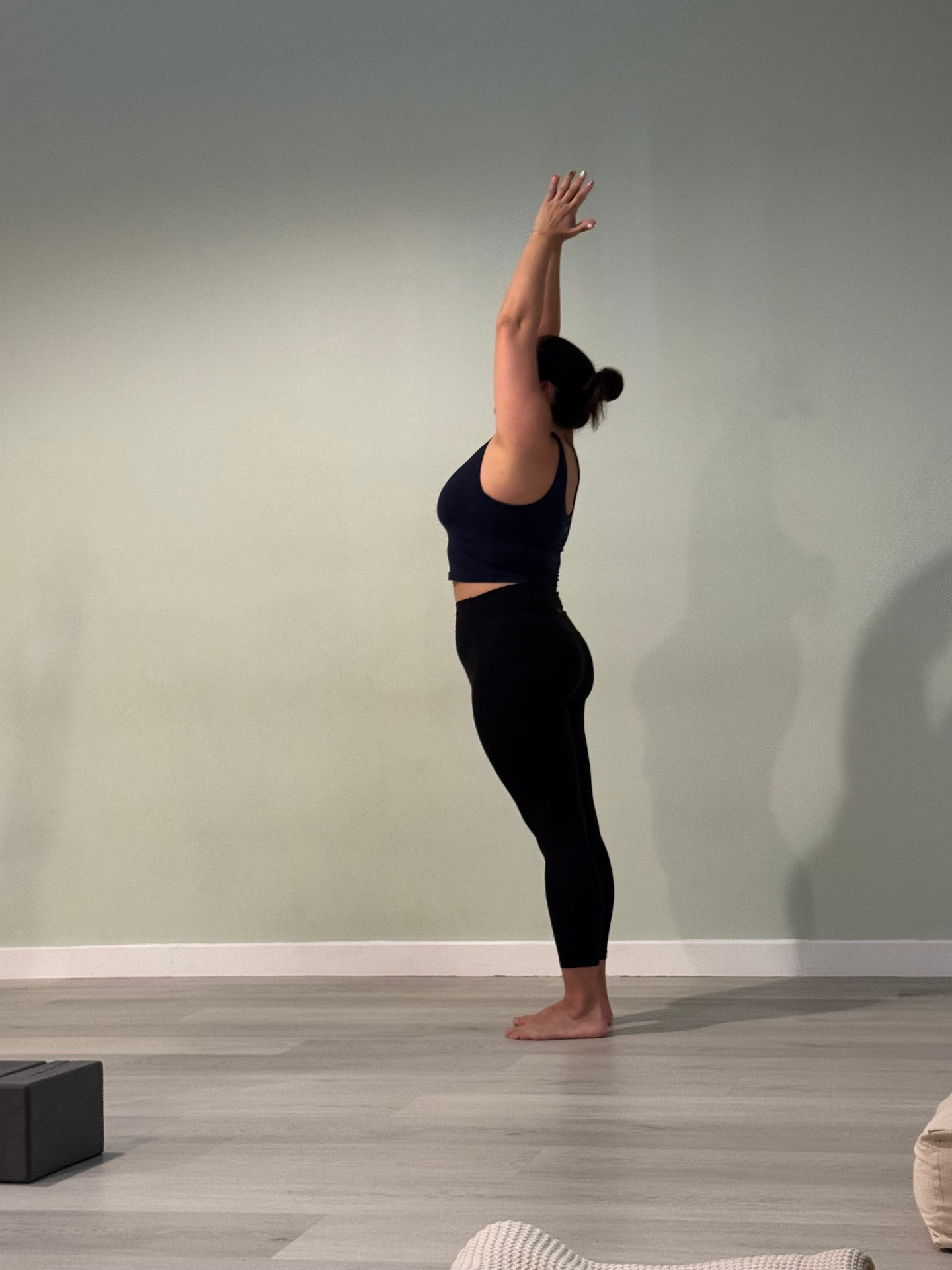Yoga mountain pose with arms raised